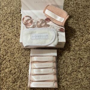 Skin Medica facial cleansing cloths, headband, & 2 cooling facial massagers